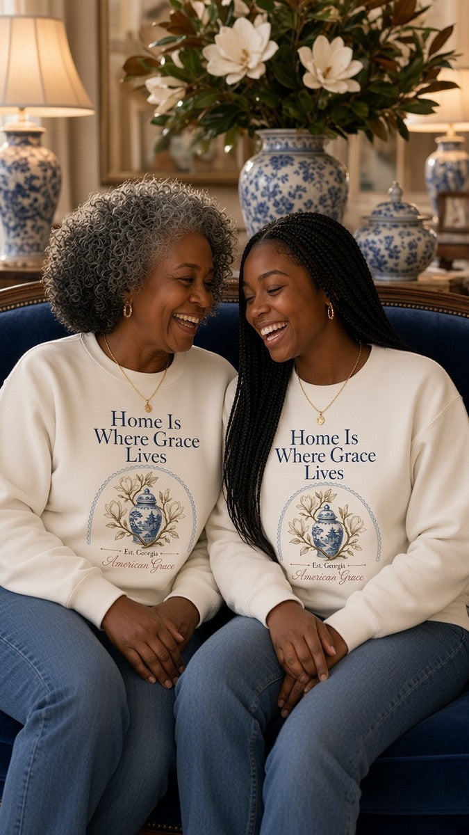 Mother and daughter in matching Home Is Where Grace Lives chinoiserie magnolia sweatshirts